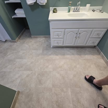 New flooring beside a white bathroom vanity
