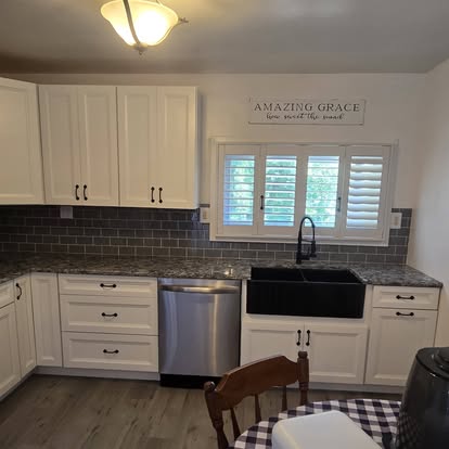 Clark’s white cabinetry and dark countertop kitchen project